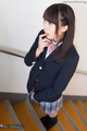 Nanami yua standing on stairs wearing uniform