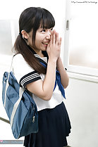 Hands clasped together wearing uniform bag over her shoulder