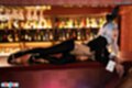 Bunny girl lying on bar giving handjob