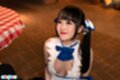 On her knees hair in pigtails looking up