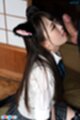 Ria kurumi on her knees looking up tongue extended