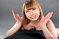 Looking up smiling broadly raising cum covered hands