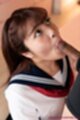 Sucking cock head looking up on her knees in uniform