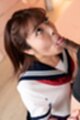 On her knees in uniform sucking cock looking up