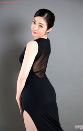 Enami Ryu in sheer black dress on her knees giving handjob and licking cum