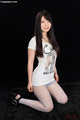 Kneeling long hair wearing tshirt in pantyhose high heels