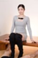 Seated wearing boots