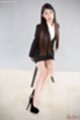 Kamimoto rio sitting on stool long hair legs stretched out black high heels