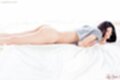 Tojo aki lying on her front cum on her pert ass