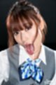 Tongue extended showing cum in her mouth