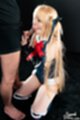On her knees sucking cock