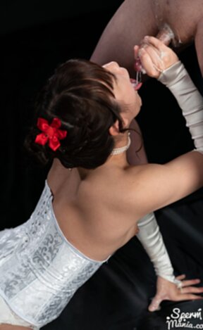 Komatsu Aya on her knees wearing basque and stockings cum in mouth