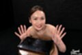 On her knees naked hands raised cum on her hands