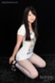 On her knees long hair falling over her chest wearing high heels.jpeg