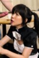 Maid on her knees looking up at cock