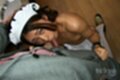 On her knees sucking cock